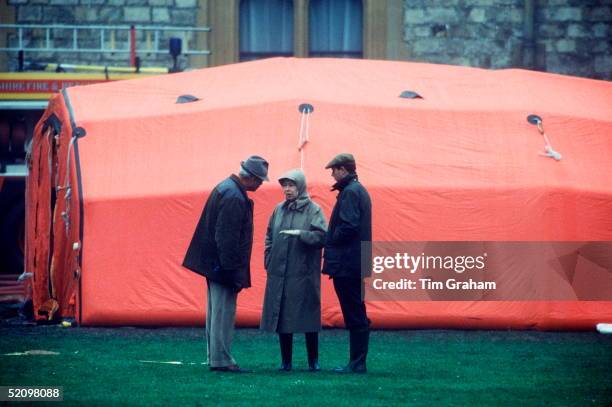 The Queen And Prince Edward Inspecting The Damage After The Fire At Windsor Castle.