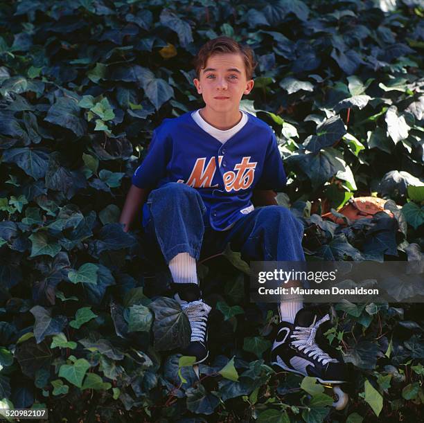 American actor Frankie Muniz wearing a New York Mets shirt, circa 2000.