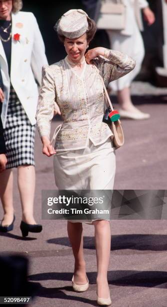 Princess Anne Adjusts Her Handbag On Her Shoulder While Walking Through The Crowds At Royal Ascot.