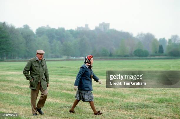 The Queen Walking In The Grounds Of Windsor Castle With The Crown Equerry Colonel Sir John Miller