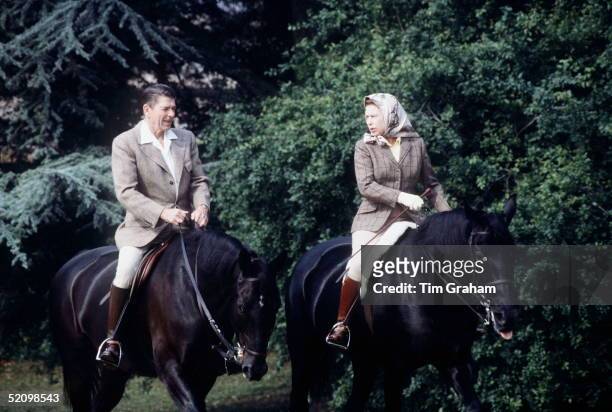 The Queen Riding With President Ronald Reagan In The Grounds Of Windsor Castle During His State Visit. She Is Riding Her Horse Burmese And He...