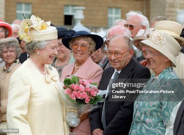 The Queen Chats To Guests At A Special Afternoon Tea Party At Buckingham Palace Held To Celebrate Her Golden Wedding Anniversary.