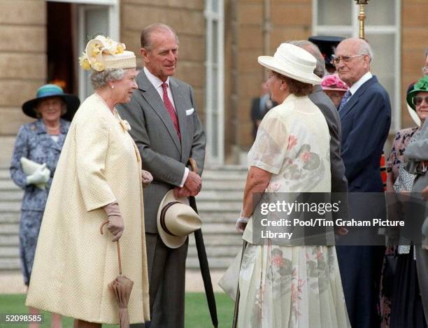 The Queen And Prince Philip Chat To Guests At A Special Afternoon Tea Party At Buckingham Palace Held To Celebrate Their Golden Wedding Anniversary.