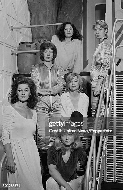 Cast of the film Inseminoid posed together on set on 6th June 1980. Clockwise from bottom left: Stephanie Beacham, Rosalind Lloyd, Jennifer Ashley,...