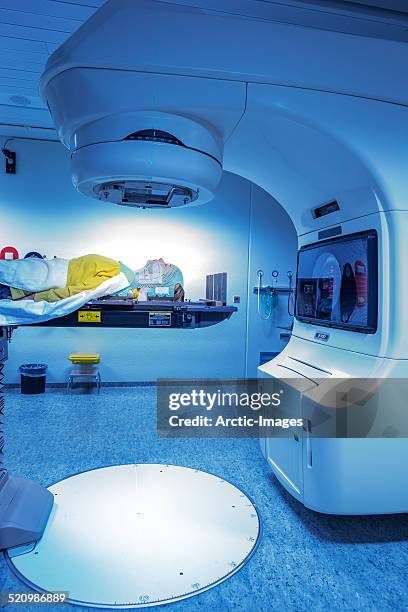 woman receiving radiation therapy. - radiotherapy stock pictures, royalty-free photos & images