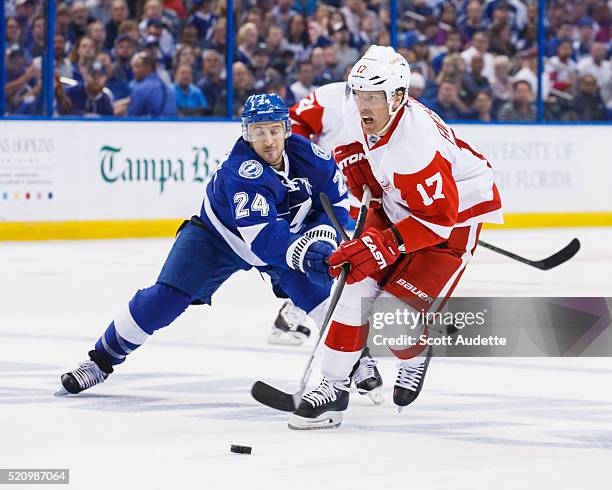 Ryan Callahan of the Tampa Bay Lightning battles for the puck against Brad Richards of the Detroit Red Wings during the second period of Game One of...