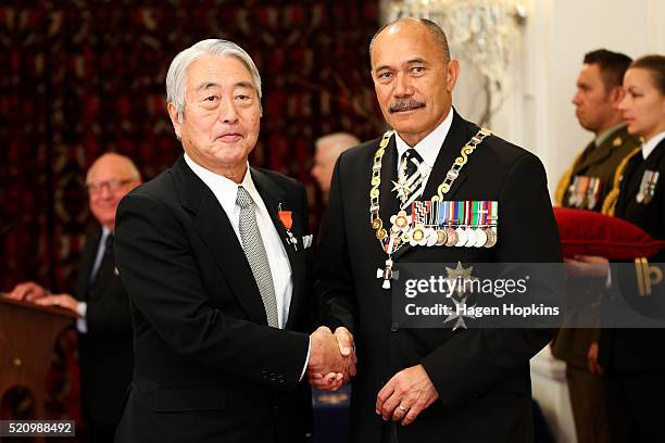 Eiichi Ishii receives the insignia of a Member of the New Zealand Order of Merit, for services to New Zealand-Japan relations, golf and tourism, from...