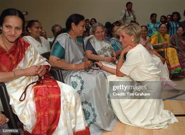 Diana, Princess Of Wales, Crouching Down To Talk To One Of The Ladies At The Shri Swaminarayan Mandir Hindu Temple In Neasden, London Nw10.