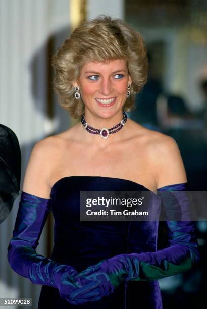 Diana, Princess Of Wales, Wearing A Purple Velvet Sleeveless Evening Dress Designed By Catherine Walker With Matching Choker And Earrings For A...