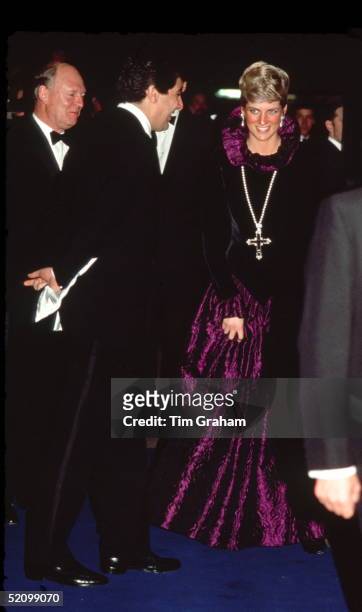 Diana, Princess Of Wales, Arriving At A Charity Gala Evening On Behalf Of Birthright At Garrard. The Princess Is Wearing A Purple Evening Dress With...