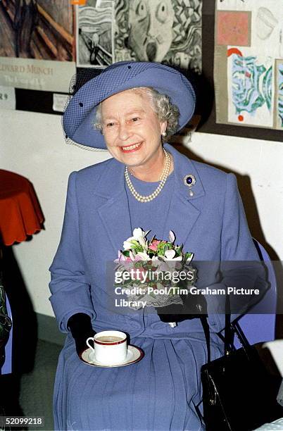 The Queen Enoying A Cup Of Tea During A Visit To The Grey Coat Hospital To Mark Its Tercentenary.