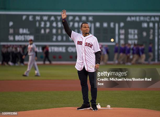 Charlie Davies of the New England Revolution waves to the crowd before throwing out a ceremonial first pitch on April 13, 2016 at Fenway Park in...