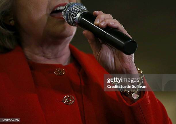 Democratic presidential candidate former Secretary of State Hillary Clinton wears a charm bracelet with an image of her granddaughter Charlotte...