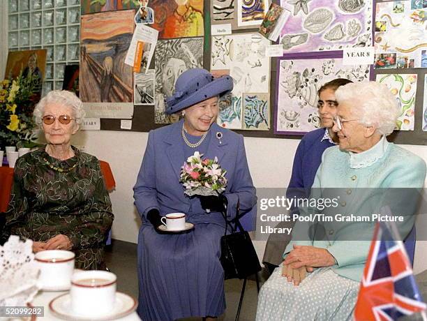 The Queen Enoying A Cup Of Tea During A Visit To The Grey Coat Hospital To Mark Its Tercentenary.