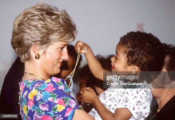 Diana, Princess Of Wales, Holding A Baby At A Hostel For Abandoned Children In Sao Paolo, Brazil. The Hostel Cares For Hiv Positive Children.