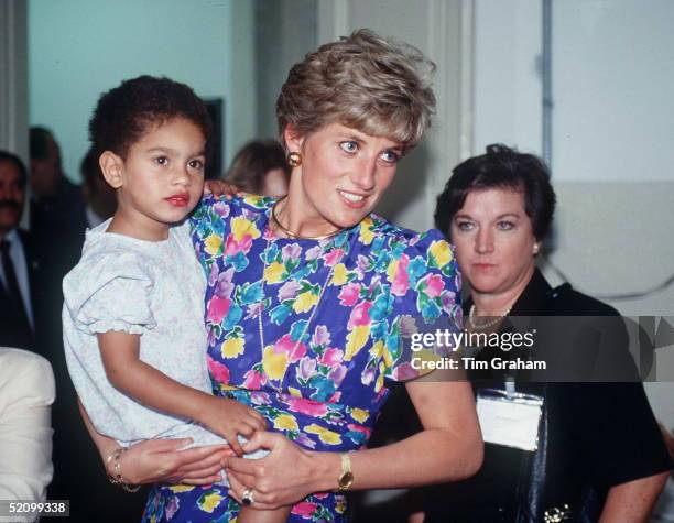 Princess Diana Holding A Young Child At Febem Hostel For Abandoned Children, Many Of Them Hiv Positive, In Sao Paulo, Brazil.
