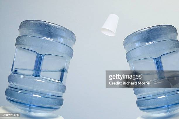 two water coolers heading paper cup - water cooler stockfoto's en -beelden