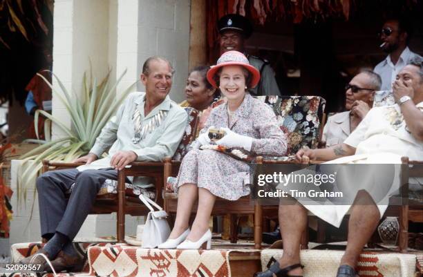 The Queen And Prince Philip Laughing Together On A Visit To Tuvalu In The South Pacific.