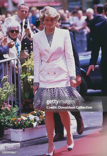 Diana, Princess of Wales wearing a puff-ball skirt and a white jacket at the Cannes Film Festival, Cannes, France, 15th May 1987.