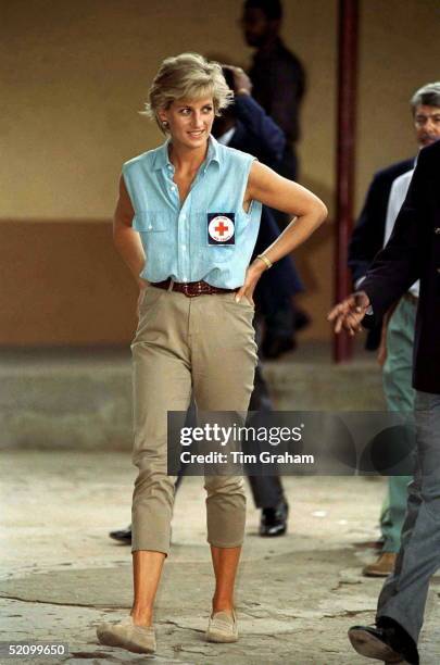 Diana, Princess Of Wales, At Neves Bendinha Orthopaedic Workshop In Luanda, Angola Wearing A Badge For The British Red Cross Charity.