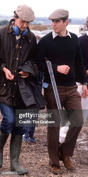 Prince Andrew Carrying A Shot Gun Under His Arm As He Talks With The Duke Of Roxburghe At A Clay Pigeon Shoot In Chester.