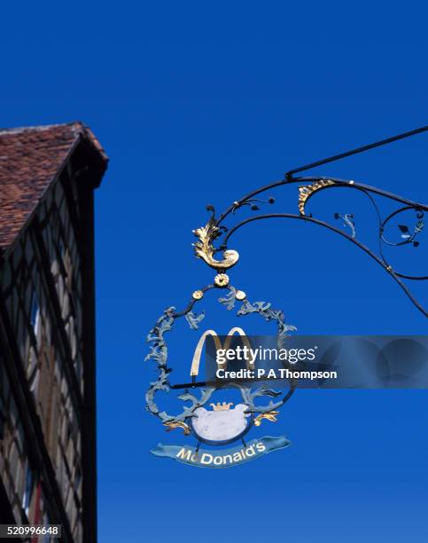 mcdonalds sign, rothenburg, bavaria, germany - rothenburg stock pictures, royalty-free photos & images