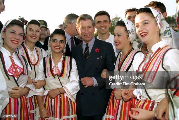 Prince Charles Arm-in-arm With Local Dancers Dressed In National Costumes During His Visit To Ohrid, Macedonia.