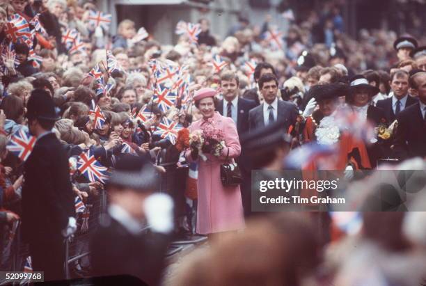 The Queen During A Walkabout In Kent. Two Police Bodyguards Behind Her In The Grey Suits. Jim Beaton Is On The Right With Black Hair.he Is The...