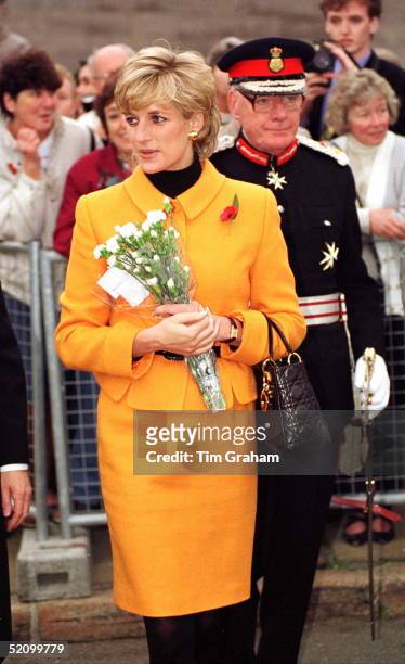 Diana, Princess Of Wales, Visiting Liverpool. She Is Wearing A Bright Orange Suit Designed By Versace And Carrying A Christian Dior Handbag.