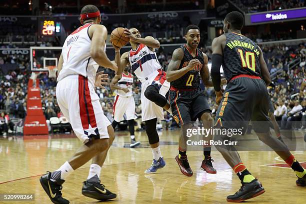Ramon Sessions of the Washington Wizards is fouled by Jeff Teague of the Atlanta Hawks at Verizon Center on April 13, 2016 in Washington, DC. NOTE TO...