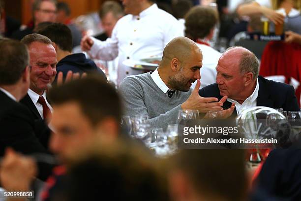 Josep Guardiola , head coach of Muenchen talks to Uli Hoeness and Karl-Heinz Rummenigge , CEO of Bayern Muenchen during the Champions Banquette at...