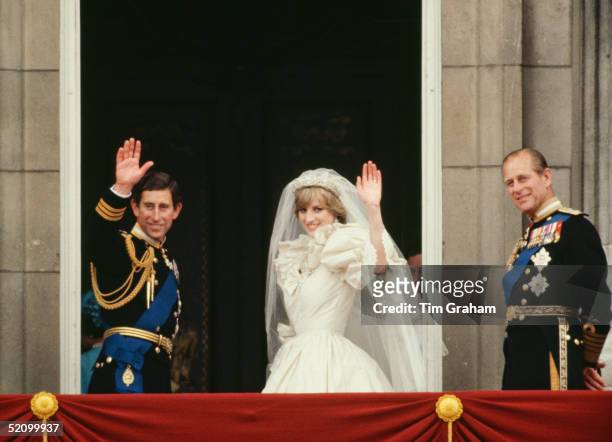 Prince Charles And Princess Diana Waving From The Balcony Of Buckingham Palace. They Are Accompanied By Prince Philip. The Princess Is Wearing A...