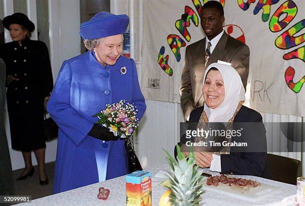 The Queen In Bedford Watching Women Prepare Fruit Salad