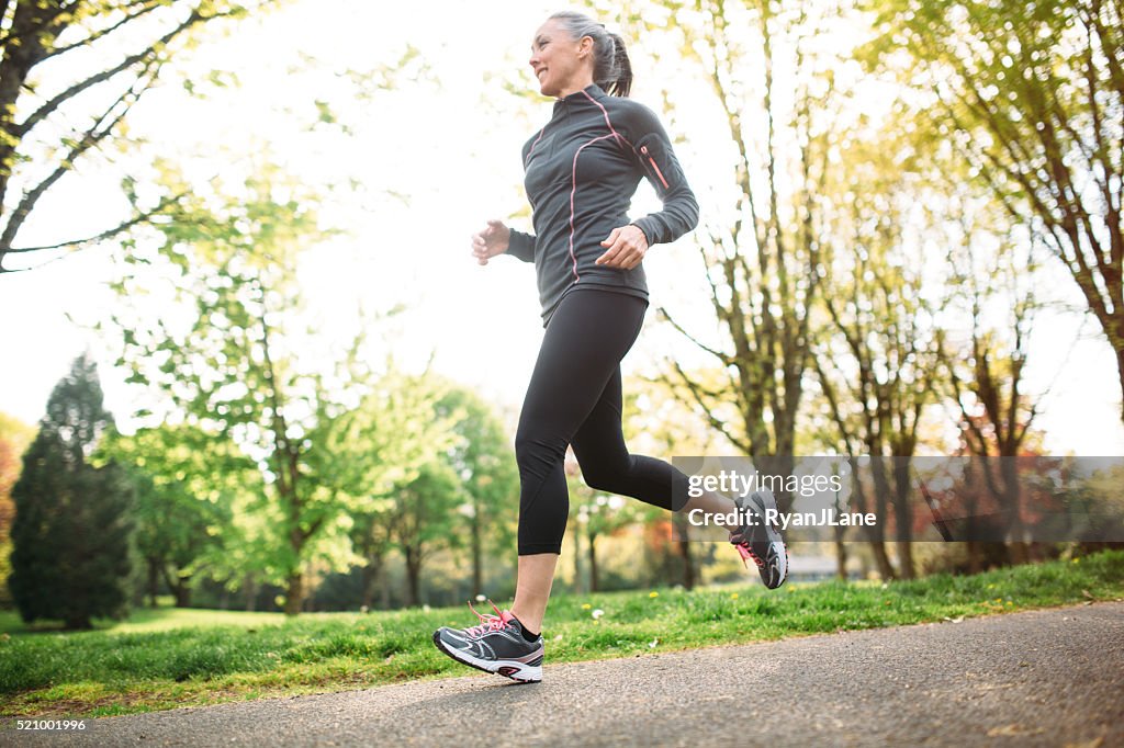 Mature Woman Jogging Outdoors