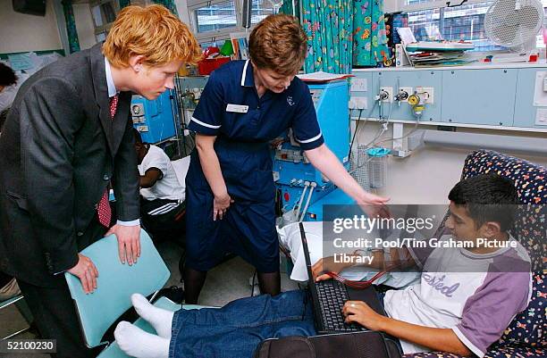 Prince Harry Meets Kidney Dialysis Patient, Michael Anderton, Right, At Great Ormond Street Hospital, London,