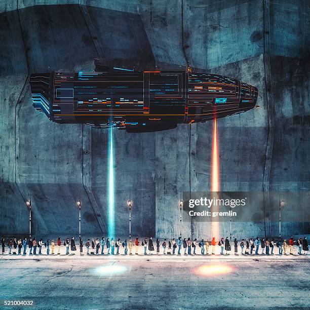 spaceship over people on the street - spaceship command stock pictures, royalty-free photos & images