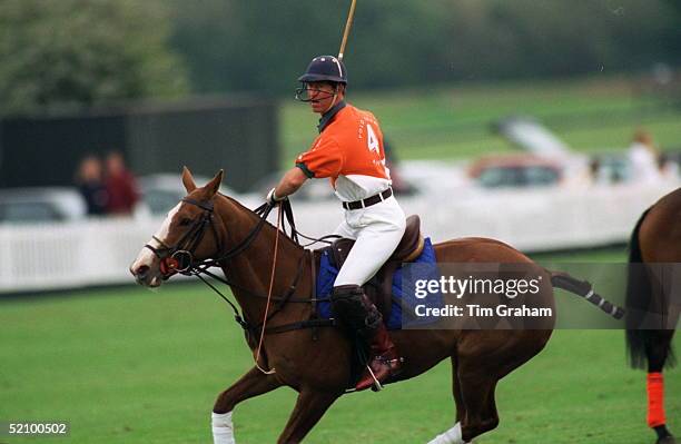 Prince Charles Cantering On His Pony At The Royal County Of Berkshire Polo Club.