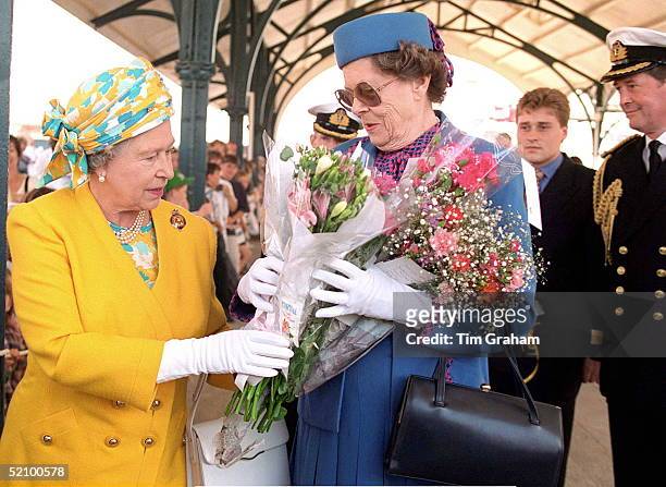 The Queen's Lady-in-waiting, Lady Kathryn Dugdale, Helps With All The Flowers Given By Wellwishers In Portsmouth As The Queen Arrived To Board Royal...