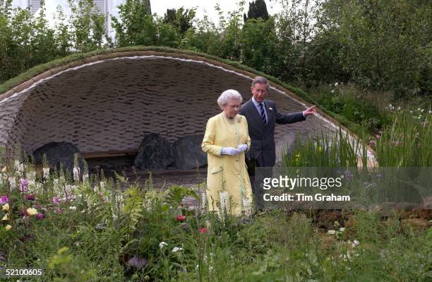 Prince Charles Showing His Mother Queen Elizabeth II Around The Garden He Had Designed For The Annual Society Event Of The Chelsea Flower Show. The...