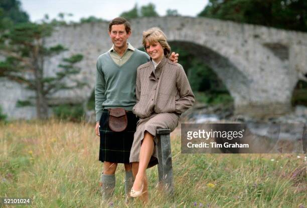 Prince Charles With His Arm Around His Wife, Princess Diana, During A Honeymoon Photocall By The River Dee. The Princess Is Wearing A Suit Designed...