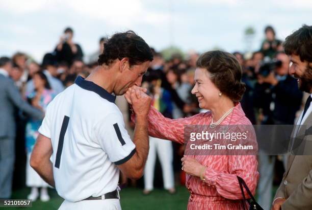 Prince Charles Kissing The Queen's Hand After She Presented Him With A Prize At Polo In Windsor