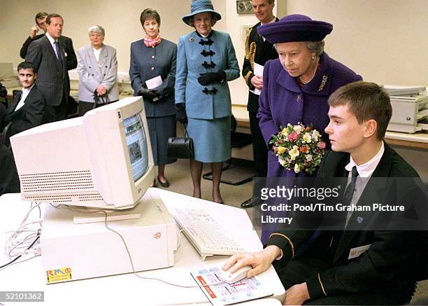The Queen Watches A Demonstration By Christopher Bailey Of How The Royal Web Site Works During Her Visit To Kingsbury High School.behind Her Lady In...