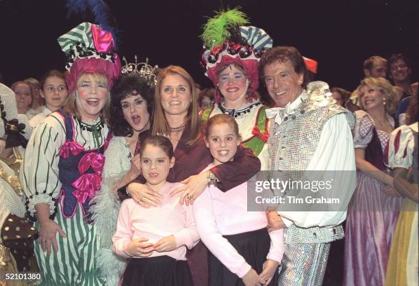 The Duchess Of York With Her Daughters, Princess Beatrice And Princess Eugenie At A Christmas Extravaganza At The Theatre Royal In Drury Lane, London...