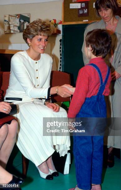 Diana, Princess Of Wales, Shaking Hands With One Of The Students Attending The Zakladni School For The Deaf And Hard Of Hearing During Her Official...