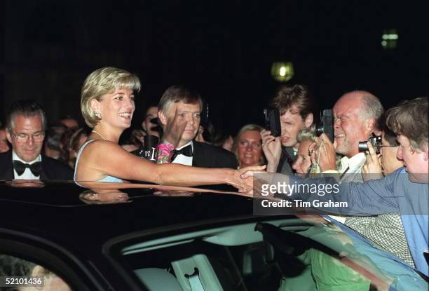 Diana, Princess Of Wales Shaking Hands With Enthusiastic Fans Including Colin Edwards Who Are Taking Her Photograph As She Leaves The Ballet 'swan...