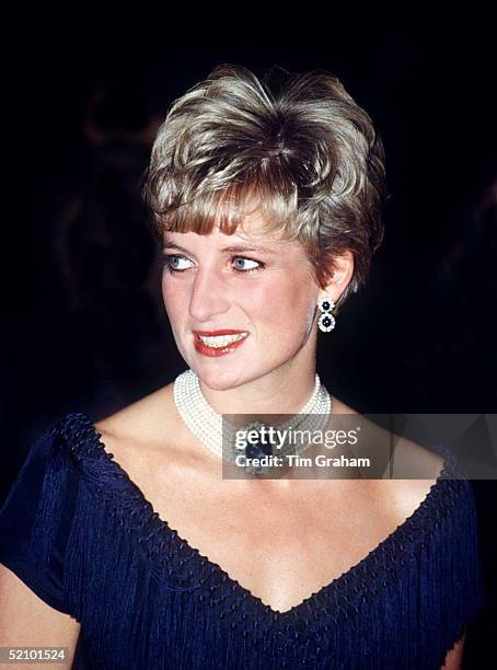 Princess Diana Wearing The Sapphire That The Q. Mother Gave To Her As A Wedding Present.