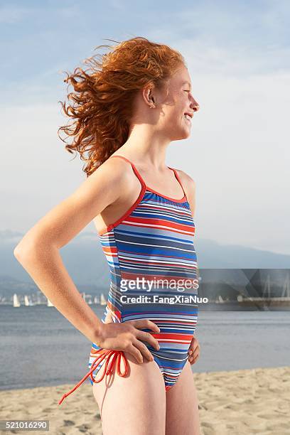 girl on the beach - tween girl swimsuit stockfoto's en -beelden