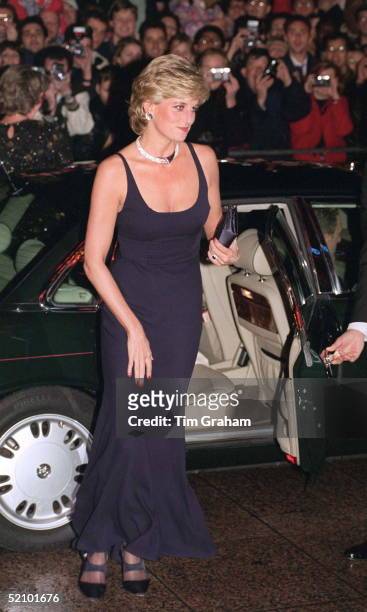 Princess Diana At Alighting Her Car For The Premiere Of The Film 'haunted' At The Empire Cinema In London. The Princess Is Wearing A Low-cut Blue...