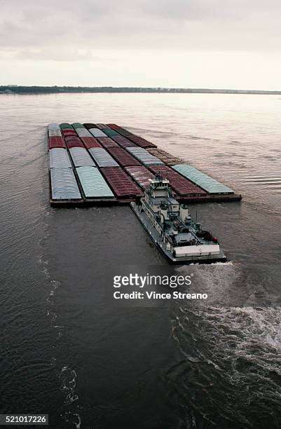 barge on the mississippi river - barge fotografías e imágenes de stock