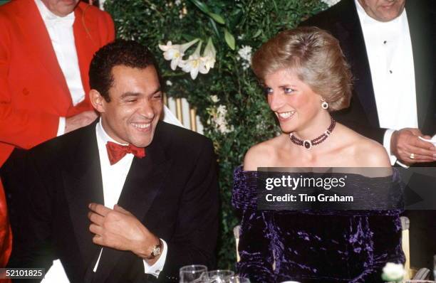 The Princess Of Wales Wearing A Crushed Velvet Purple Evening Dress Designed By Bruce Oldfield Which Featured As Lot No. 73 At The Auction Of Her...